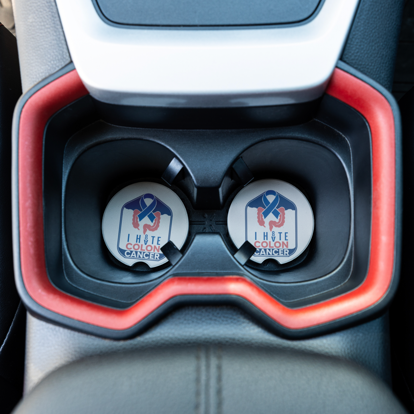 Colon_Cancer_Awareness_Coaster_CarCoaster_CarInterior_Overhead_Mockup.png
