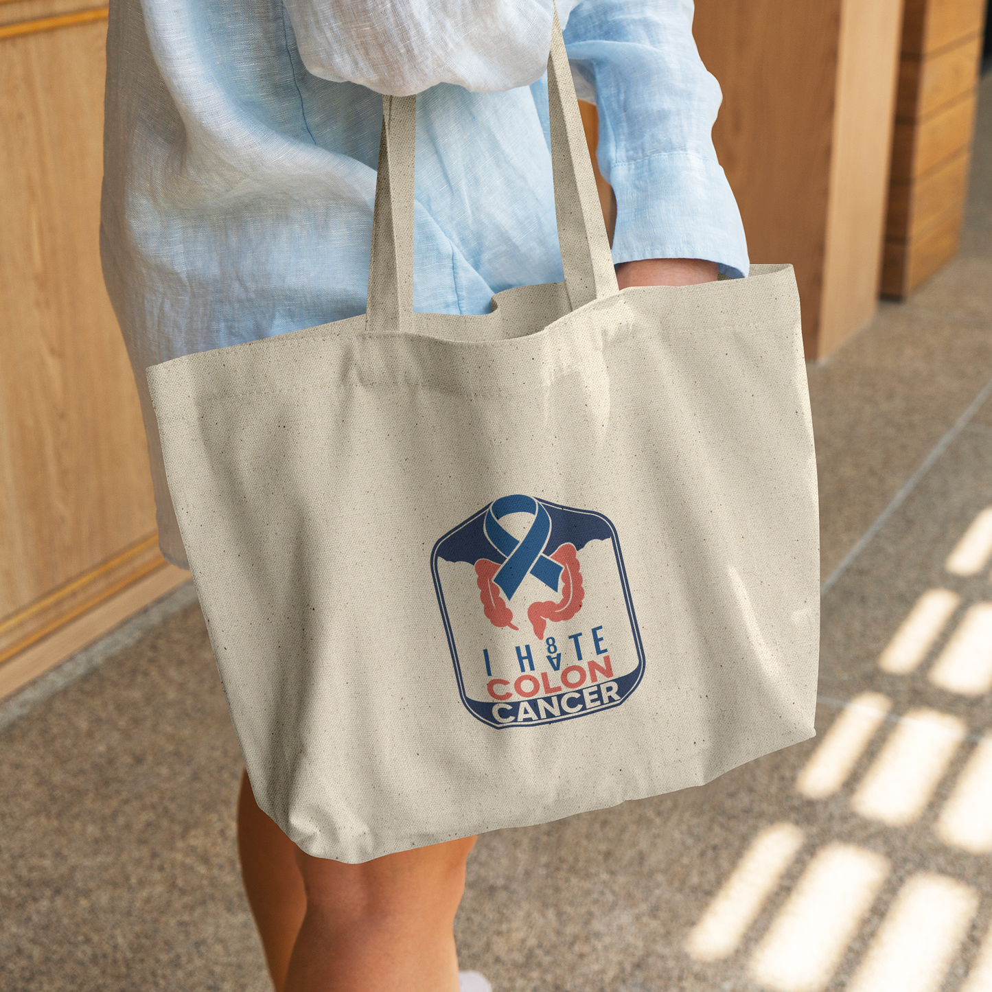 Colon_Cancer_Awareness_Gusseted_Cotton_T_CottonTote_L_WomanDigging_Mockup.png
