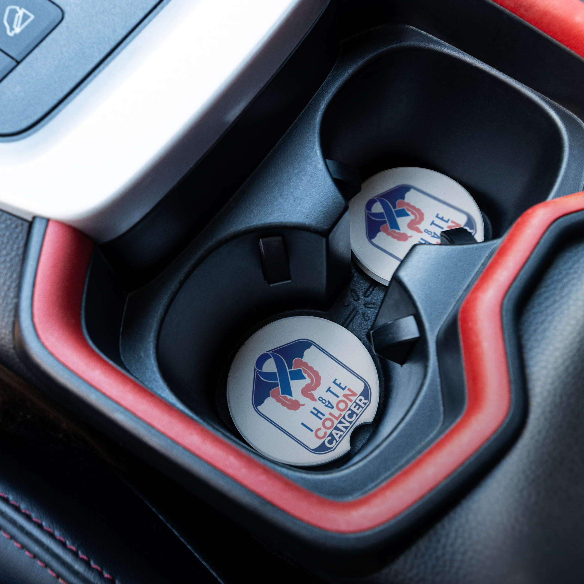 Colon_Cancer_Awareness_Coaster_CarCoaster_CarInterior_Angle_Mockup.png