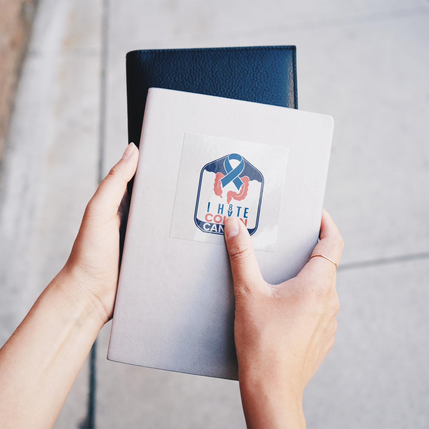 I_H8TE_COLON_CANCER_Stickers_ClearSquareSticker_Notebook_Mockup.png