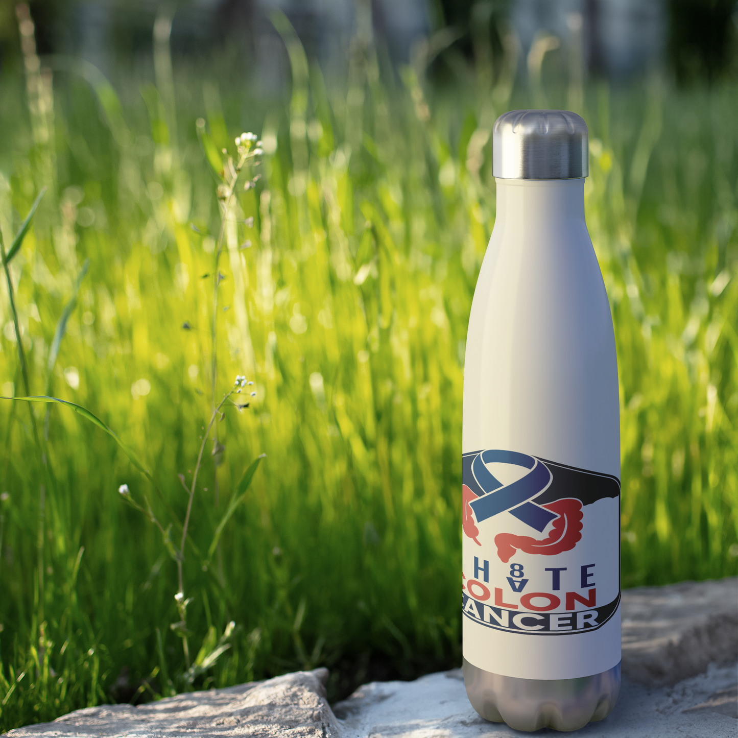 I_HATE_COLON_CANCER_Stainless_Steel_Wate_WaterBottle_Outdoor_grass_Mockup.png